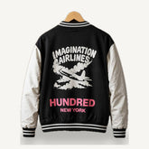 Imagination Airlines Varsity Jacket — Black / Cream — OUT-01_imagination-varsity_black_01-back