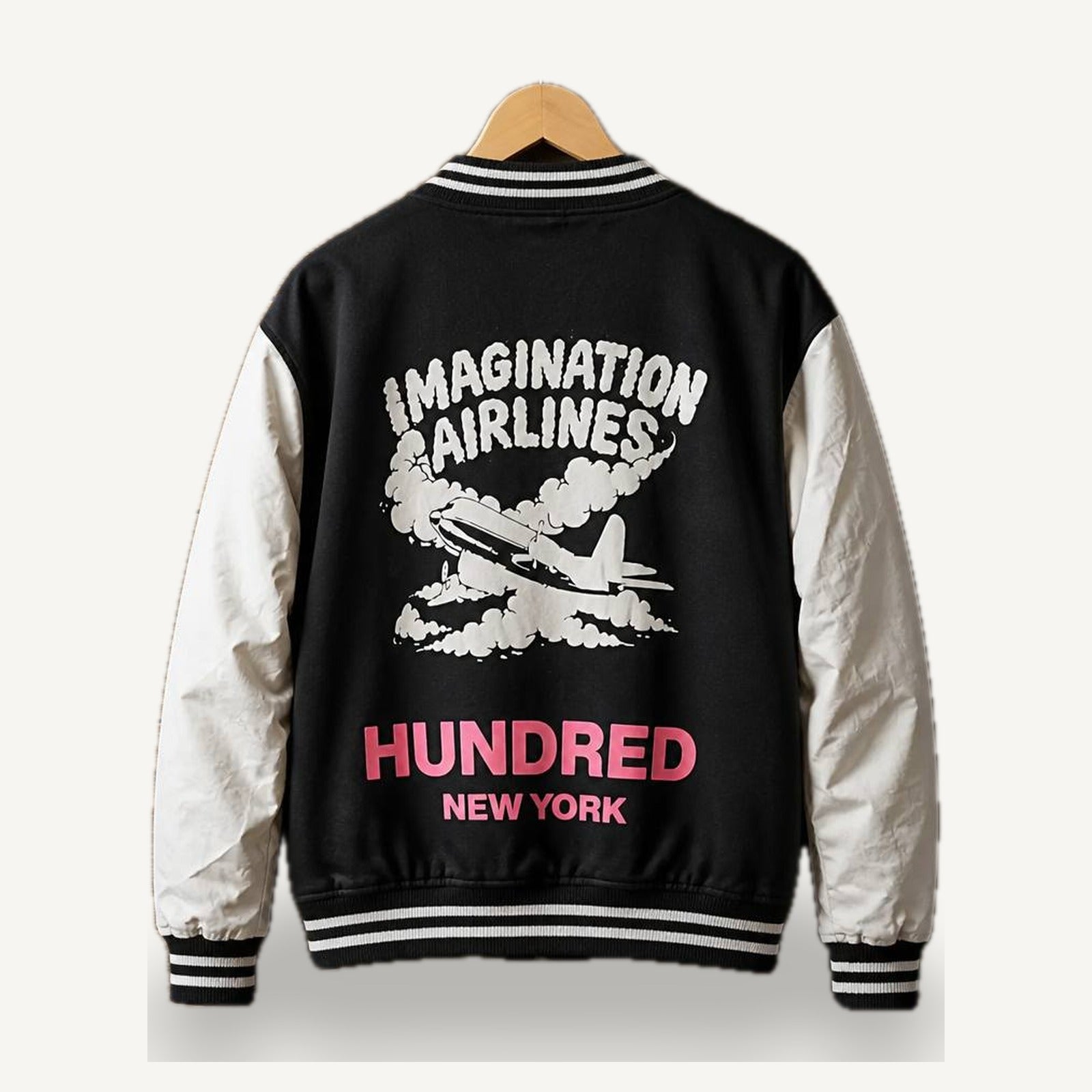 Imagination Airlines Varsity Jacket — Black / Cream — OUT-01_imagination-varsity_black_01-back
